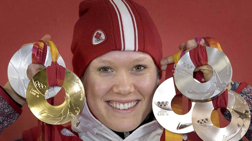 Cindy Klassen holding medals